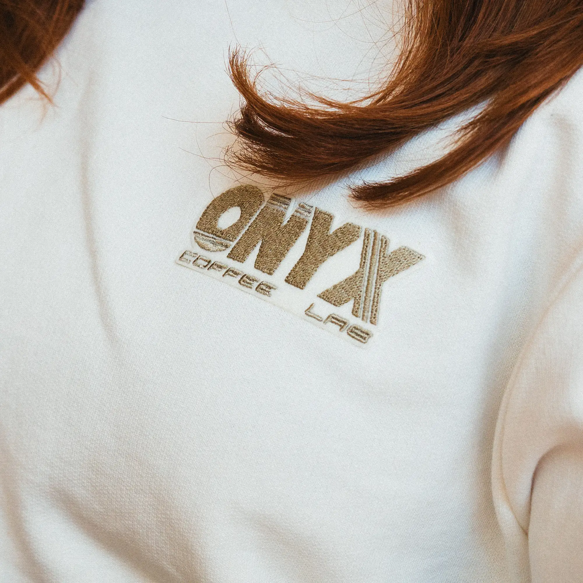 Picture behind 'NEW MERCH'